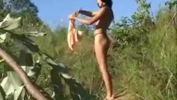 Bronzed babe pees