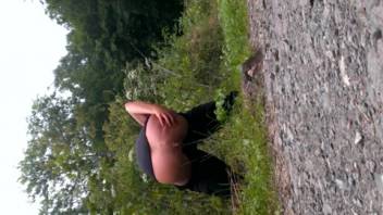 Curvy booty girl defecating beside the street