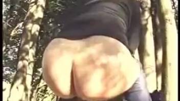 Chick with huge booty taking a dump in the forest
