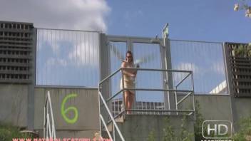 Girl defecating and urinating on outdoor stairs